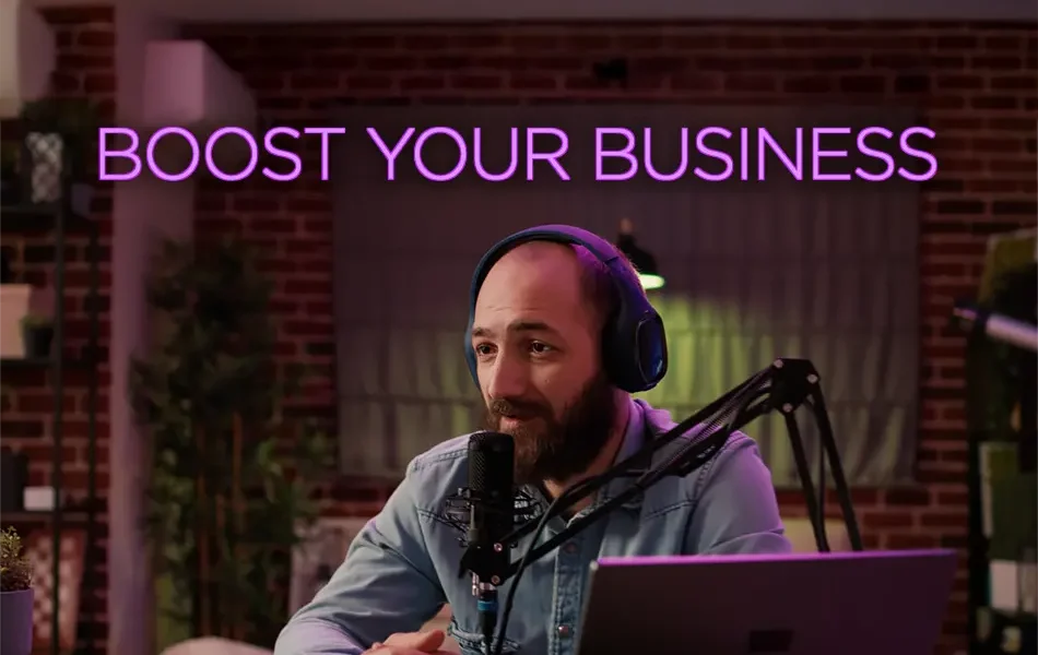 Blogger, in his studio, in the midst of conducting his podcast on YouTube. Text in glowing purple states Boost Your Business.