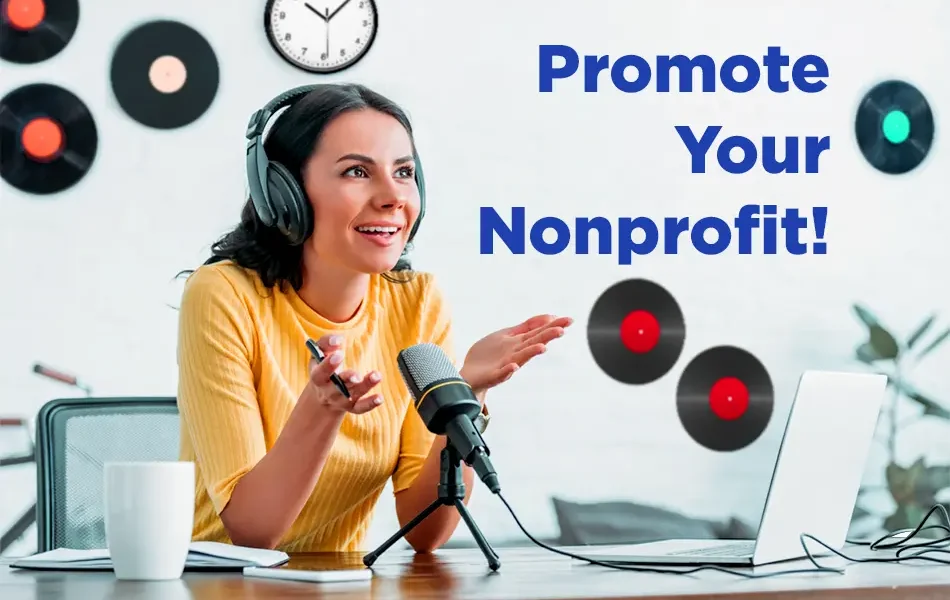 Woman wearing headphones speaks into a microphone at a desk with a laptop and coffee mug, styled like a podcast or virtual event setup, with the text “Promote Your Nonprofit!” displayed on the right.